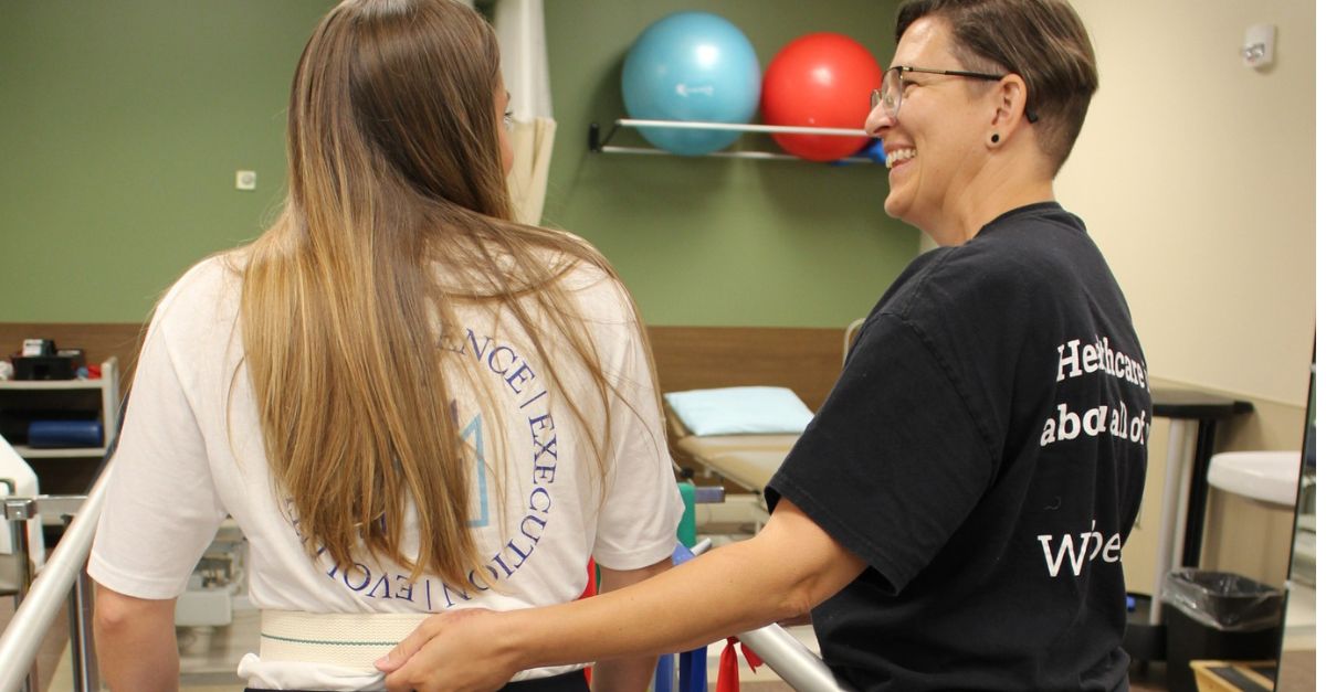Susan Tinch, a recreational therapist at Morgan Medical Center, assisting a patient during a therapy session.