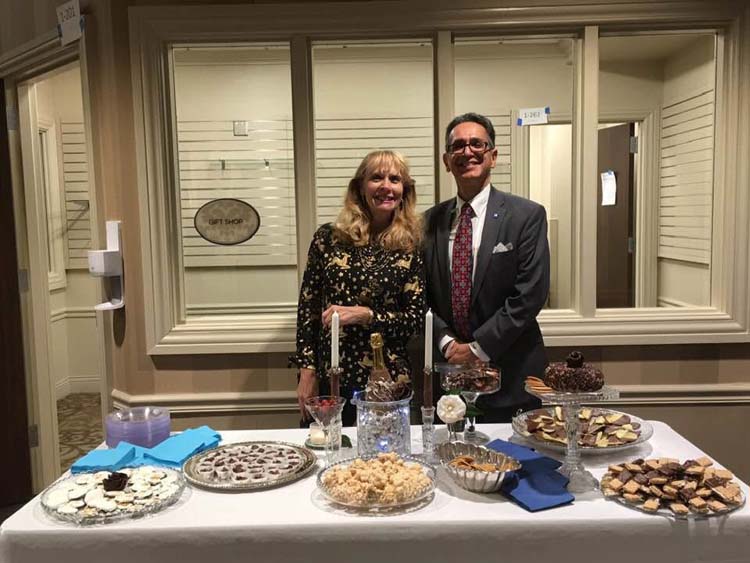 Sarah Burbach smiling with the CEO of Morgan Medical Center at an event.